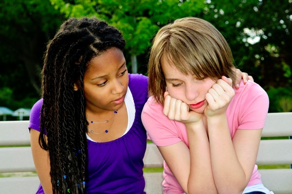 Girl helping her friend