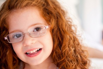 Red headed girl wearing glasses