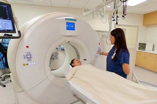 Nurse preparing patient for radiology imaging