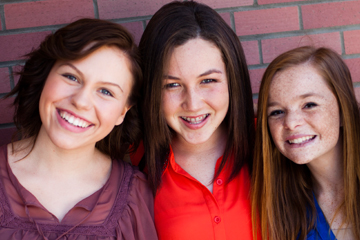 Three smiling teen girls