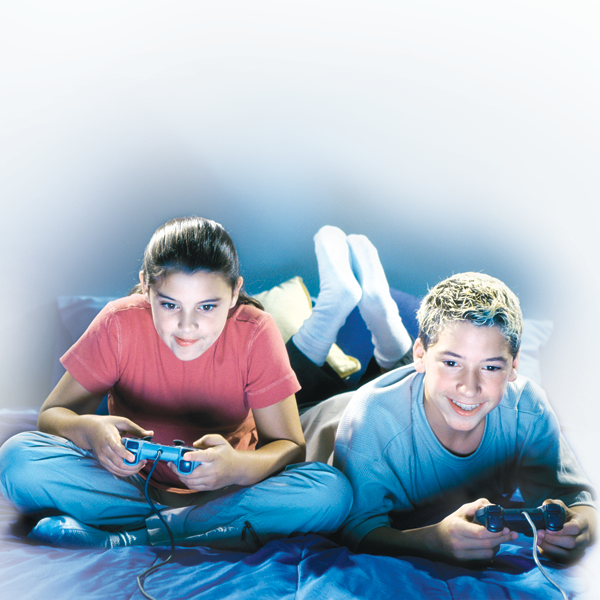 Teen boy and girl with controllers playing video game