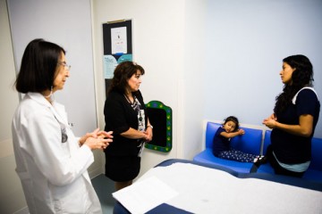 Physician and family in room for consultation