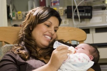 Mom feeding her baby in the NICU