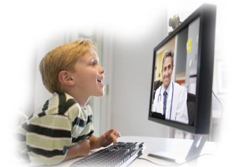 Boy engaged with physician via teleconference