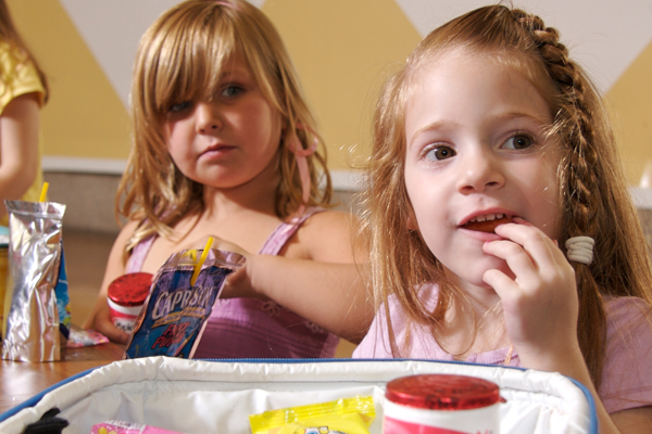 Young girls eating lunch at school