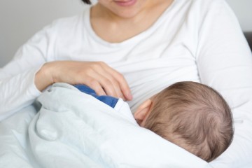 Mom breastfeeding her infant