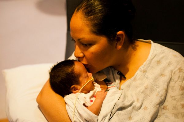 Mom with her infant in the NICU