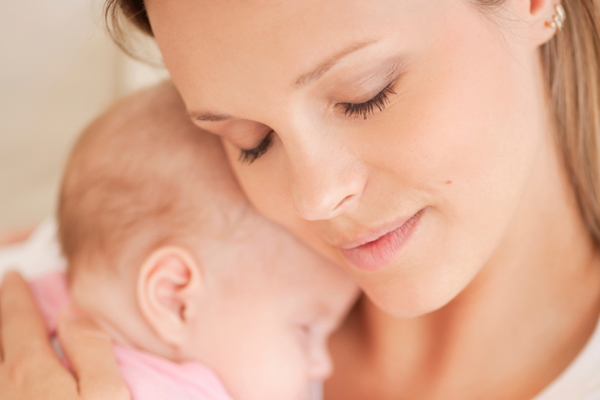 Mom holding her infant