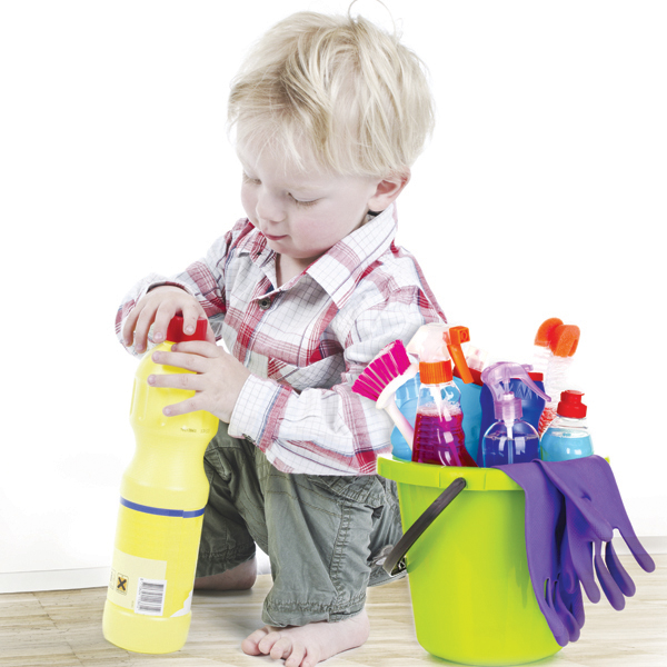 Toddler boy trying to open bottle with cleaner fluid
