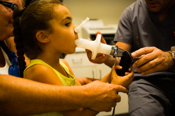 Girl having a pulmonary function test