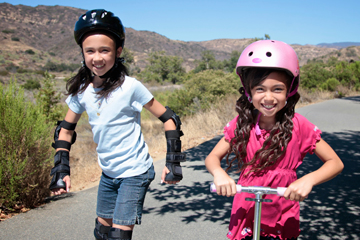 Girls outside wearingi their helmets