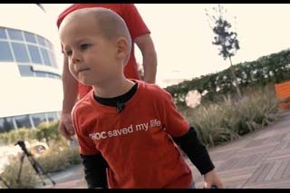 Child diagnosed with Acute Myeloid Leukemia in hospital patio