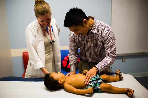 Small boy getting a physician exam