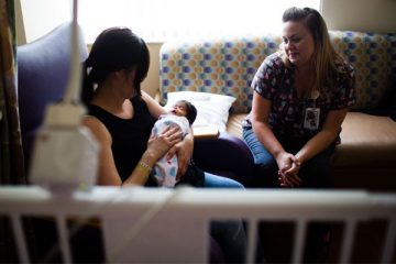 private NICU room with mom, baby and nurse