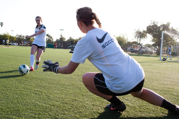 Teen girls playing soccer