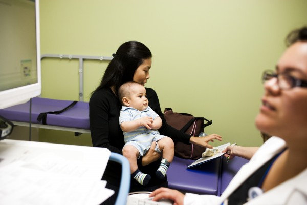 mom holding baby boy at clinic