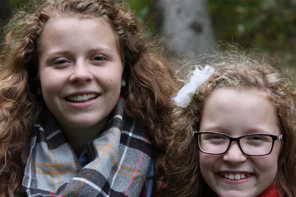 Sisters smiling together