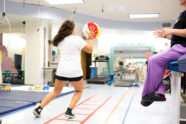 Teen girl in sports rehabilitation