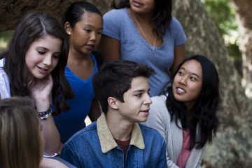 Teenagers gather in a park