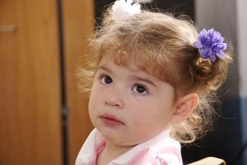 Cute toddler girl with bows in her hair