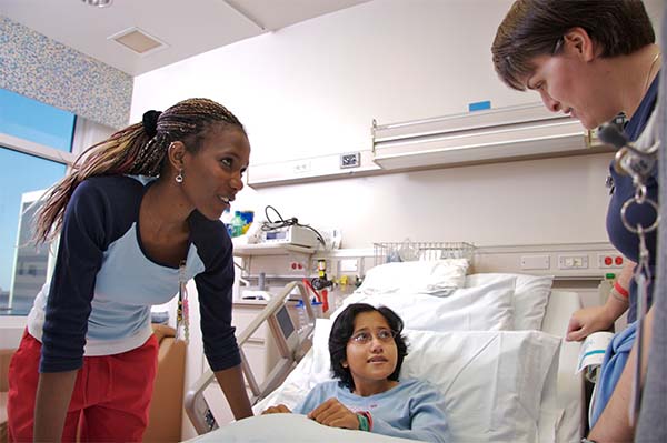 Nurse with mom and patient