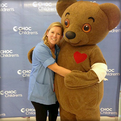 Joani, a volunteer at CHOC, with Choco Bear