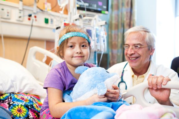 Doctor and leukemia patient at a hospital room