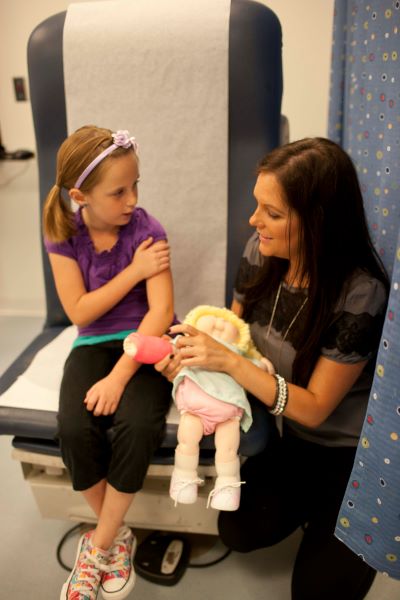 child life specialist with young patient