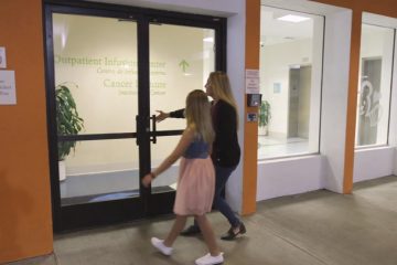 Mom and daughter at the clinic entrance