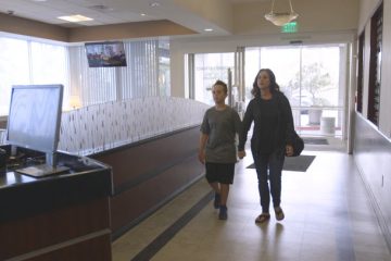 Mom and son entering emergency department