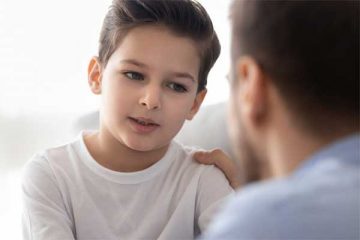 Father talking with young son