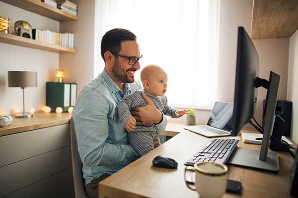 Dad with baby on telehealth appointment