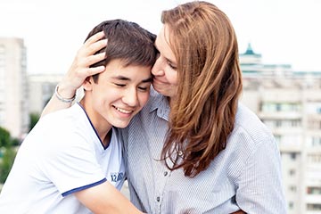 Mom and son hugging