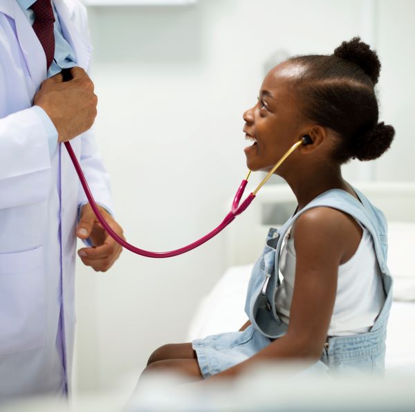 patient listening to doctor's heartbeat