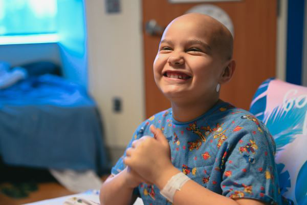 Young CHOC oncology patient smiling