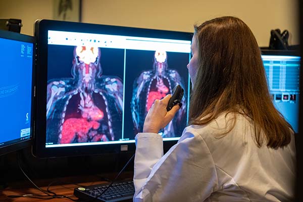 pediatric nuclear medicine radiologist evaluating scans