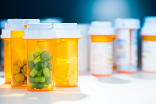 several prescription medications in pill containers
