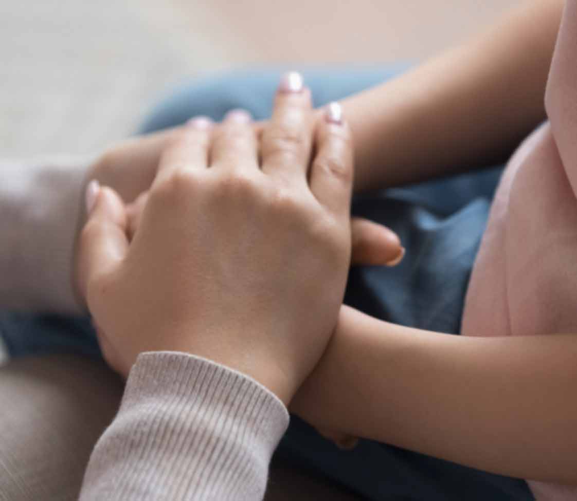 parent holding child's hands