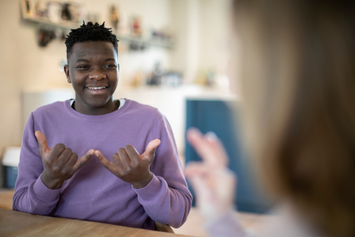 Deaf teenager having conversation in sign language